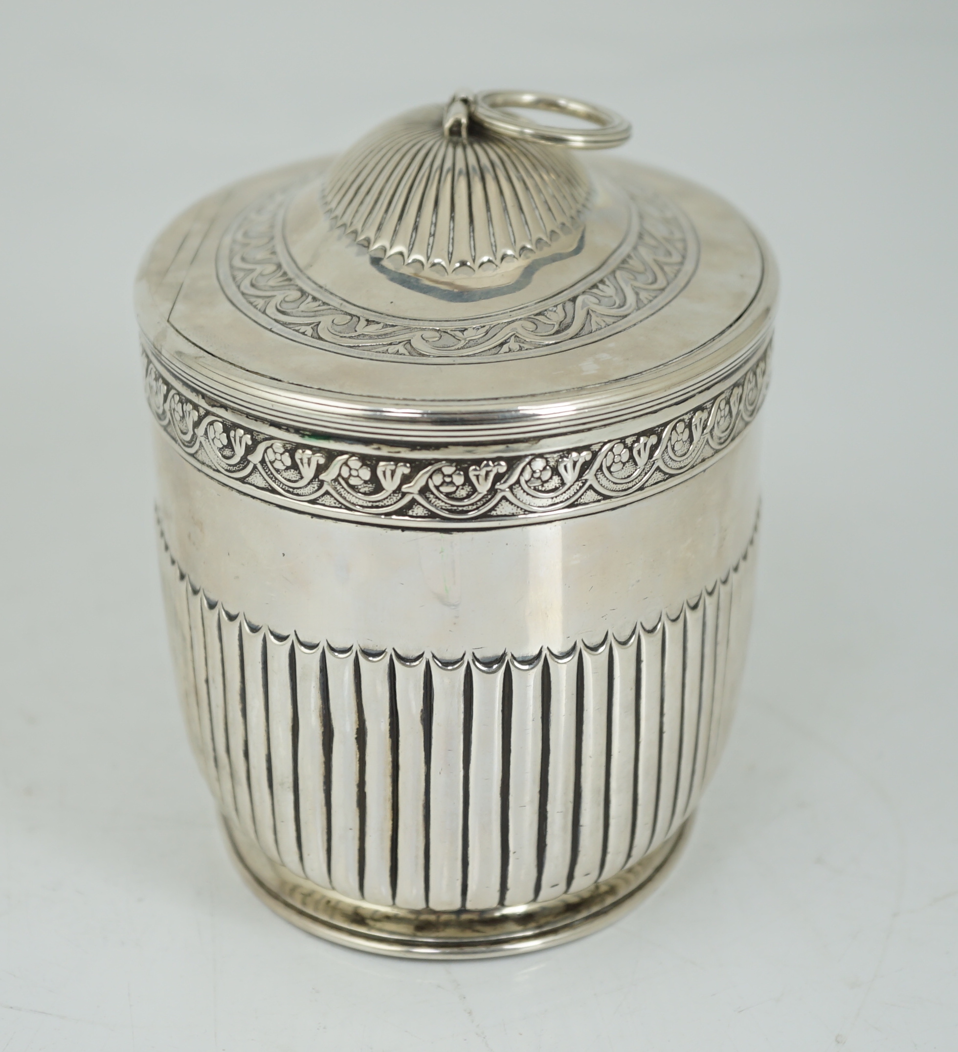 A George III demi fluted silver oval tea caddy by Andrew Fogelberg & Stephen Gilbert